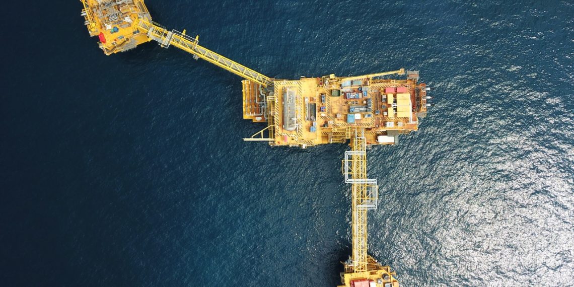 Oil and gas professionals reviewing vendor management workflows